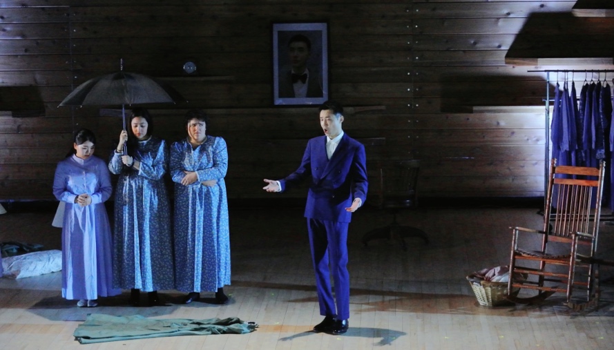 A group of people on a stageDescription automatically generated