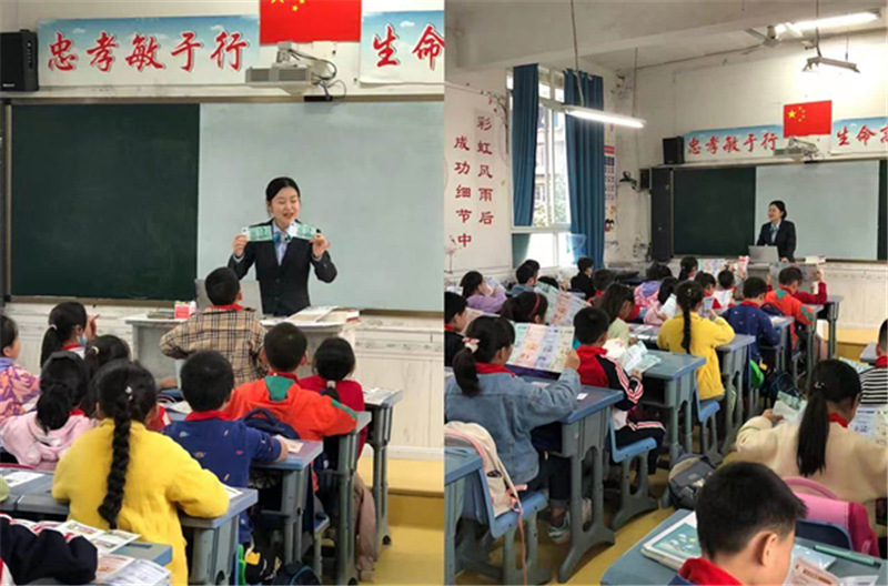 1637913625348690.jpg 向学生现场讲解人民币知识.jpg